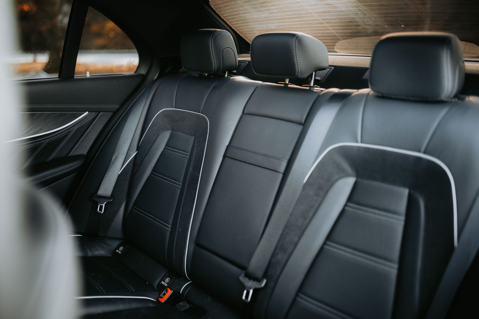 Black leather rear seats inside a luxury car